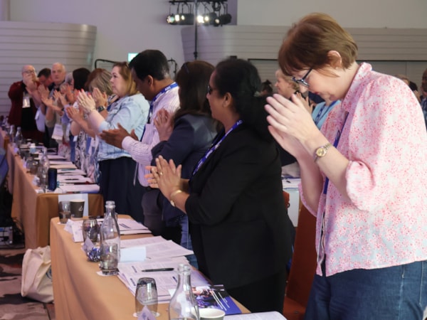 Members standing ovation at conference